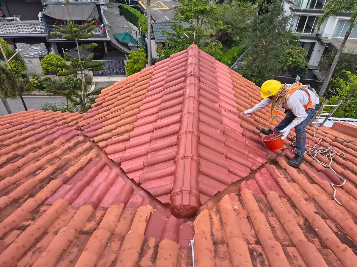 NexTech technician doing landed, terrace & bungalow waterproofing on a flat roof in Singapore