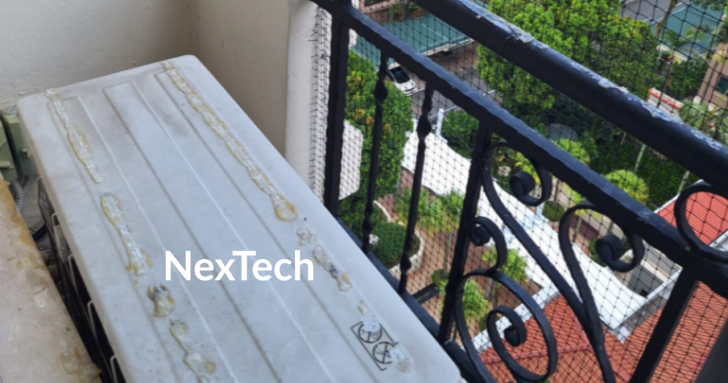 Bird net install HDB aircon ledge with bird spikes and netting installed in Singapore