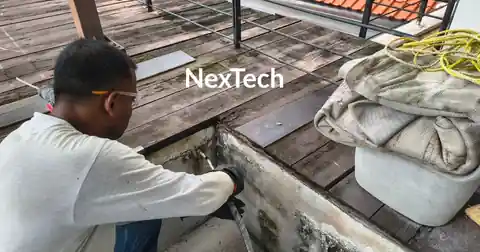 NexTech technician repairing water seepage from wall Singapore parapet joint